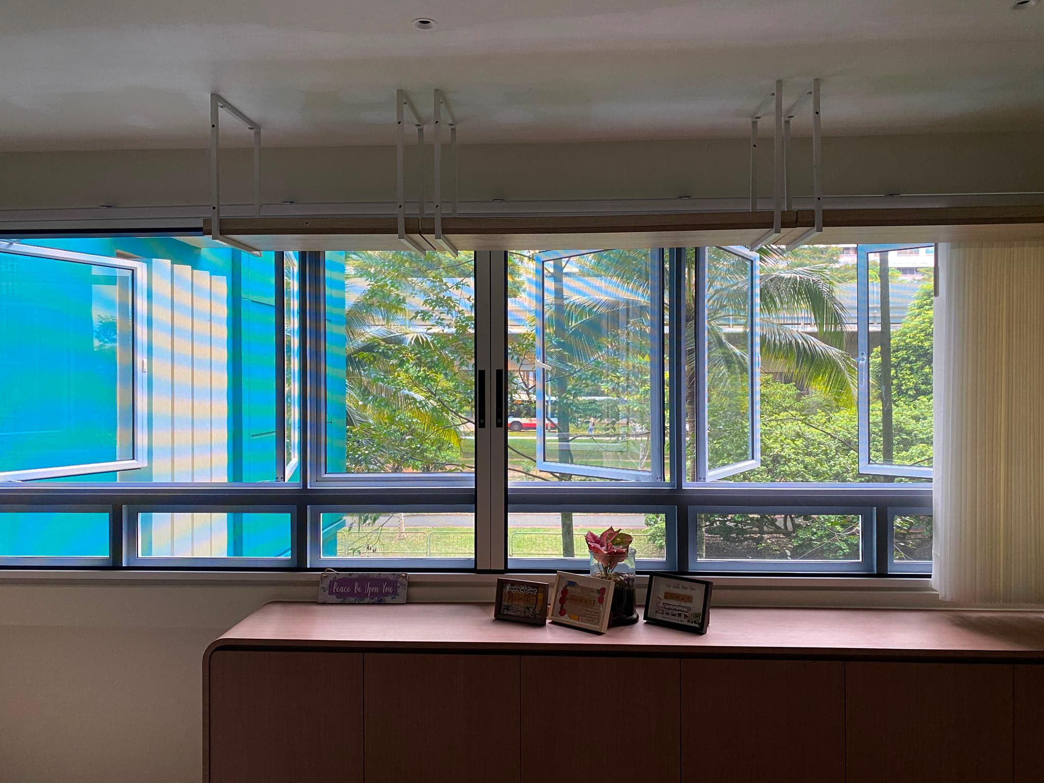 A genuine PurrSafe installation fitted across a wide multi-panel window in a Singapore home